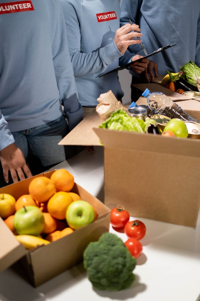 our-story Energetic volunteers organize fresh fruits and vegetables for a community relief effort.